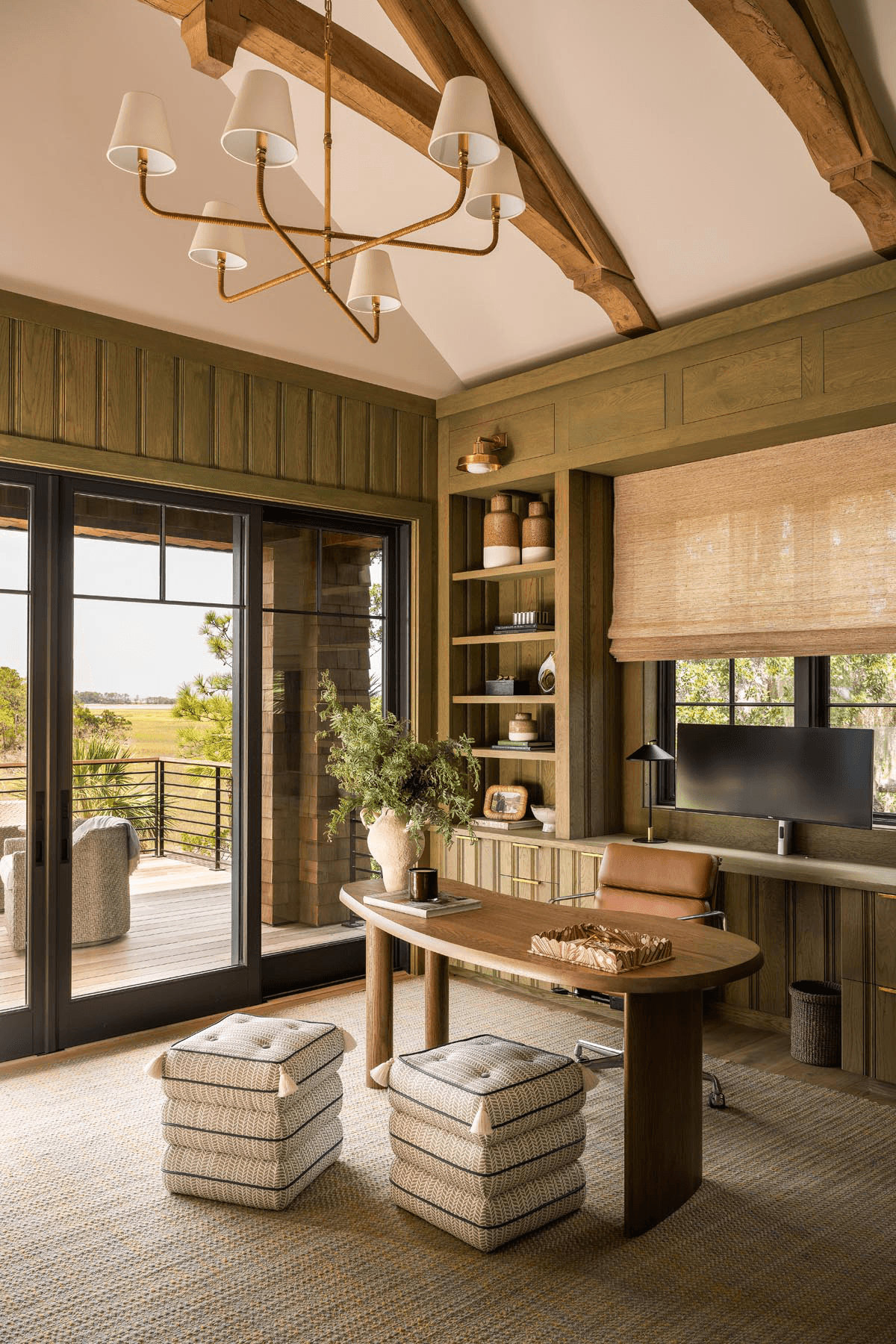 Luxury custom home office with wood paneling and vaulted ceiling