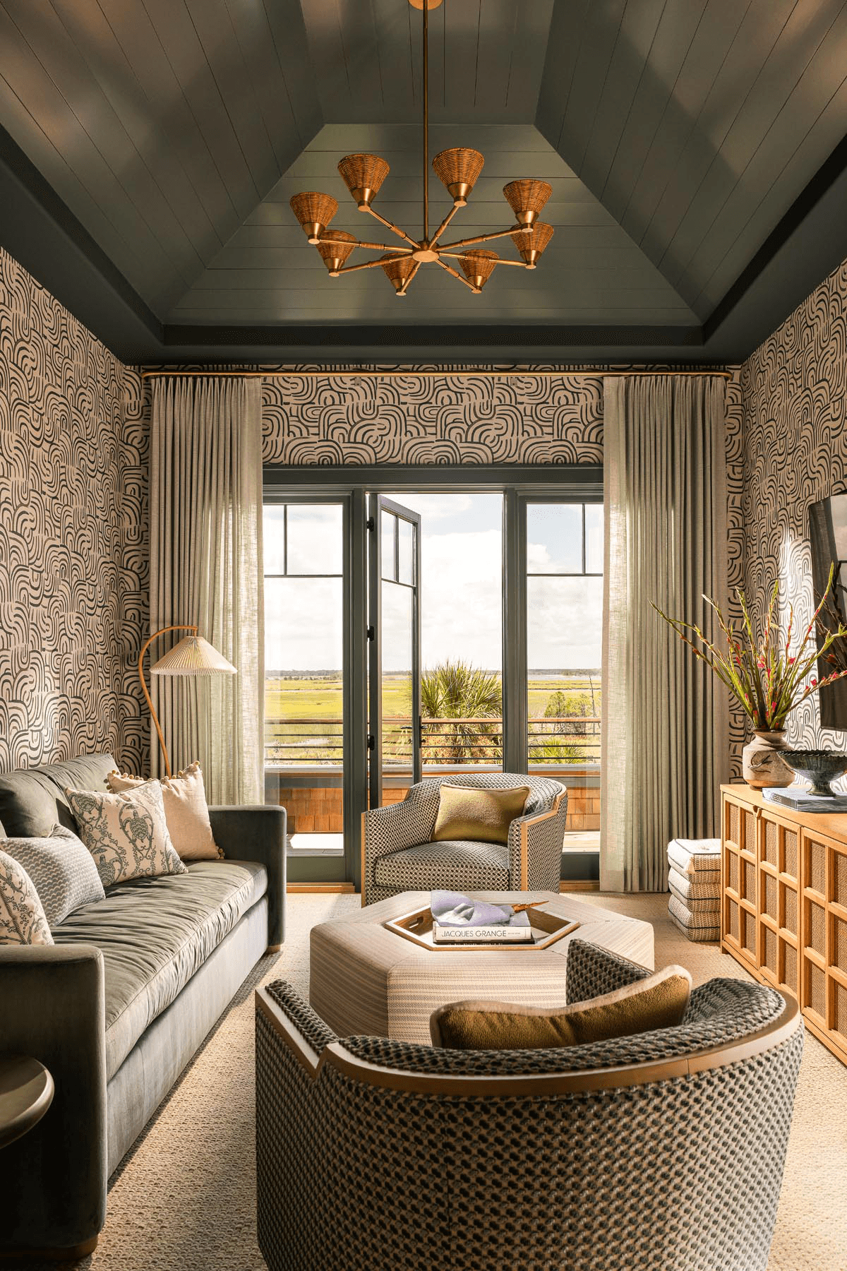 Refined sitting room with vaulted ceiling and natural light