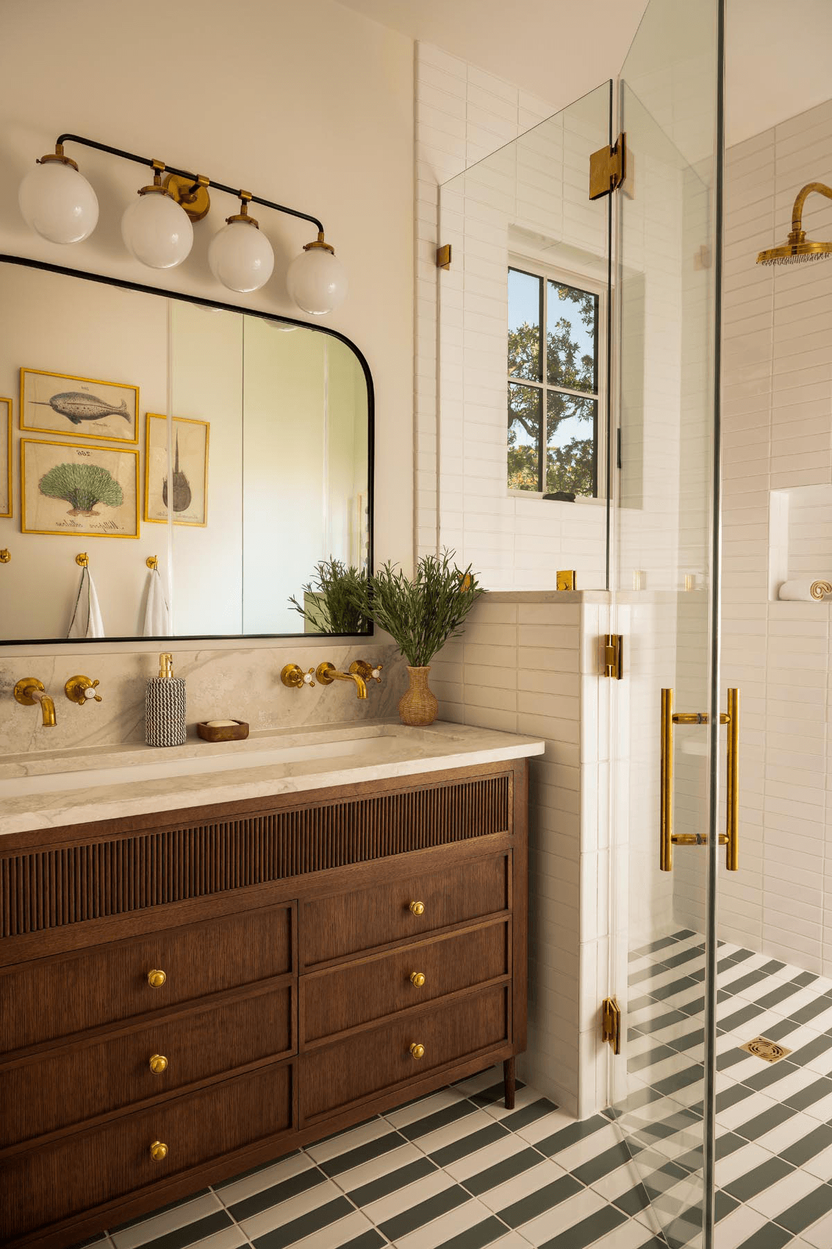 Custom bathroom vanity with marble tile and brass fixtures
