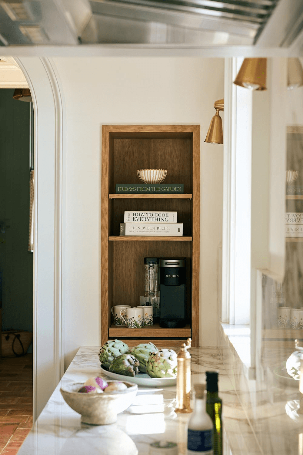 Custom kitchen built-in with oak shelving and marble countertop detail