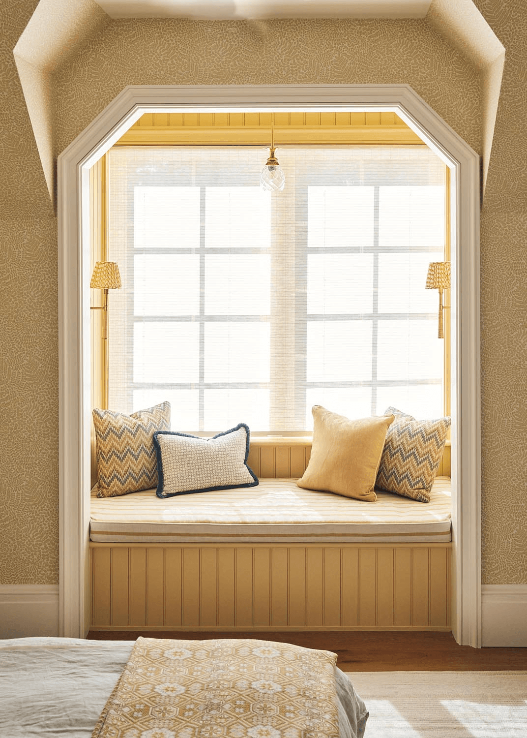 Custom window seat nook with built-in bench and warm natural light
